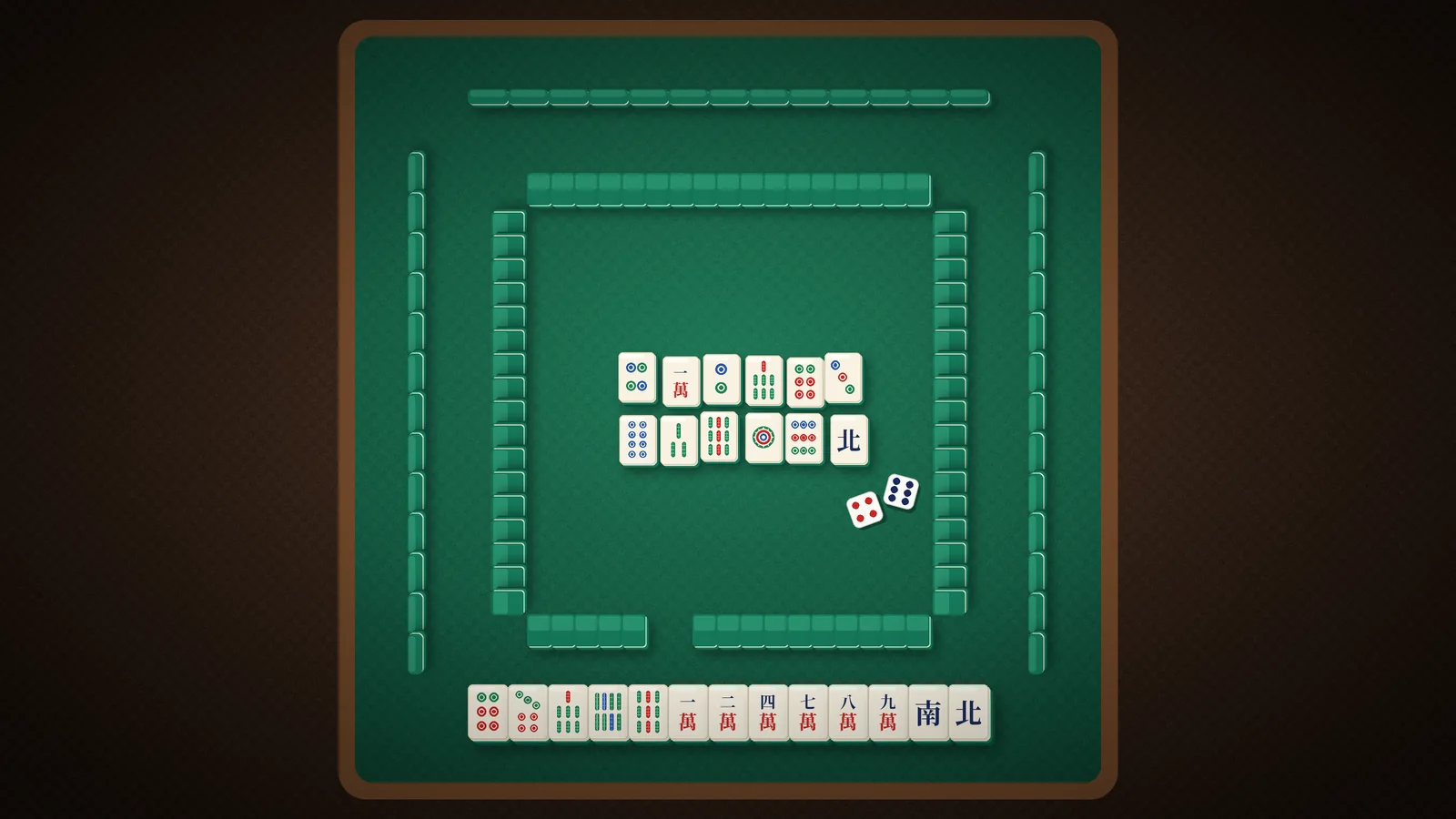 Vue de dessus d'une table de Mahjong avec les quatre murs, les mains et les défausses